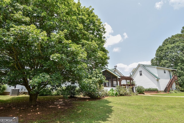 2048 Swint Rd, Griffin, GA 30224 - view of grassy yard featuring central AC and a sunroom