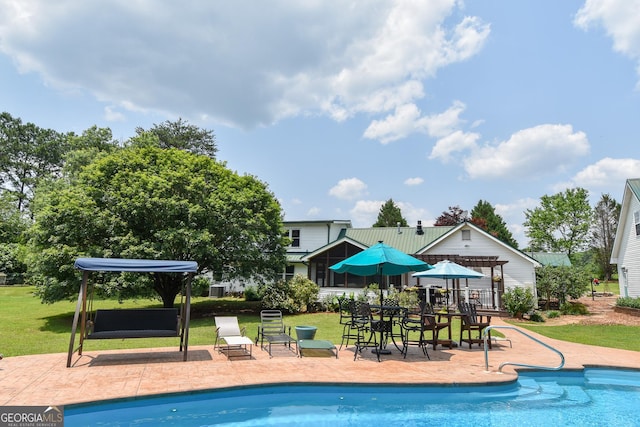 2048 Swint Rd, Griffin, GA 30224 - swimming pool featuring a yard and a patio area