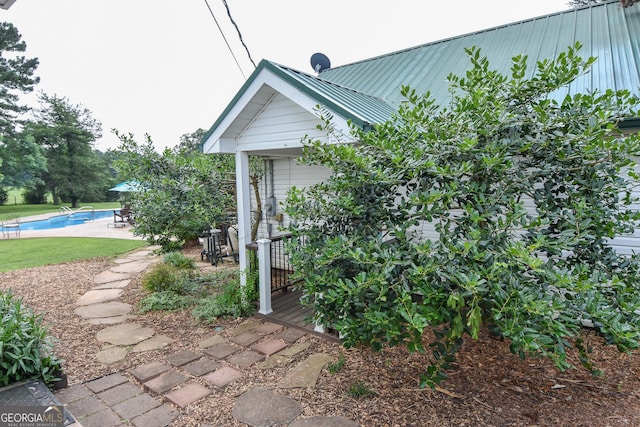 2048 Swint Rd, Griffin, GA 30224 - view of side of property with an outdoor pool, metal roof, and a patio area