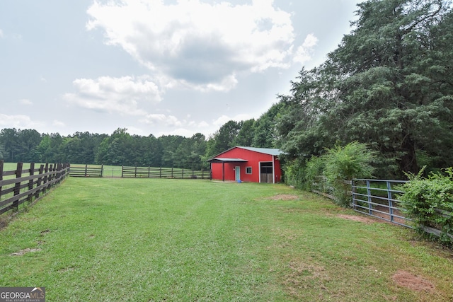 2048 Swint Rd, Griffin, GA 30224 - view of yard featuring a forest view, an outbuilding, a pole building, and a view of countryside