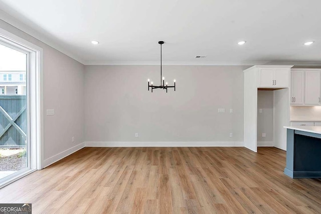 206 Grady Burrell Dr, Holly Springs, GA 30115 - unfurnished dining area featuring a chandelier, light wood finished floors, ornamental molding, baseboards, and recessed lighting