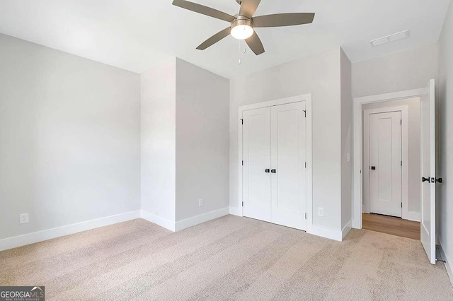 206 Grady Burrell Dr, Holly Springs, GA 30115 - unfurnished bedroom with light carpet, baseboards, and a closet