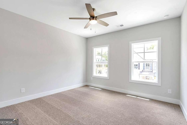 206 Grady Burrell Dr, Holly Springs, GA 30115 - carpeted empty room with baseboards and ceiling fan