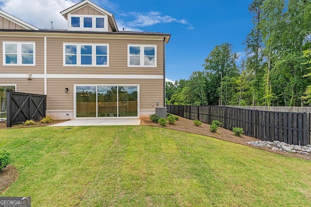 206 Grady Burrell Dr, Holly Springs, GA 30115 - rear view of house with board and batten siding, central AC unit, and a patio