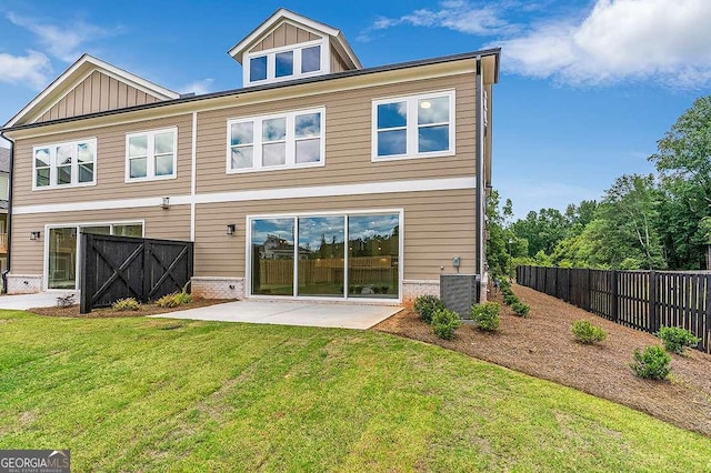 206 Grady Burrell Dr, Holly Springs, GA 30115 - back of property featuring a patio, board and batten siding, and central AC