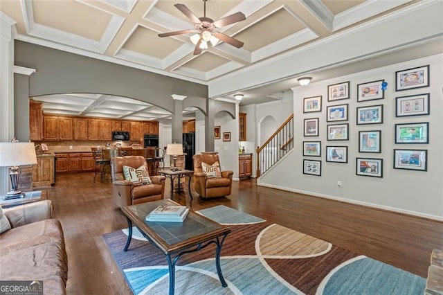 9065 Yellow Pine Ct, Gainesville, GA 30506 - living area featuring coffered ceiling, arched walkways, a ceiling fan, dark wood finished floors, and beamed ceiling