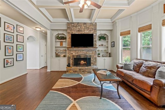 9065 Yellow Pine Ct, Gainesville, GA 30506 - living room featuring a ceiling fan, dark wood-style floors, built in features, a fireplace, and arched walkways