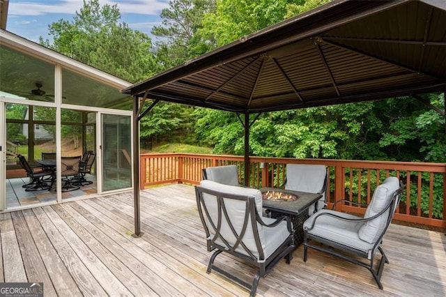 9065 Yellow Pine Ct, Gainesville, GA 30506 - wooden deck featuring a fire pit, a gazebo, and outdoor dining space