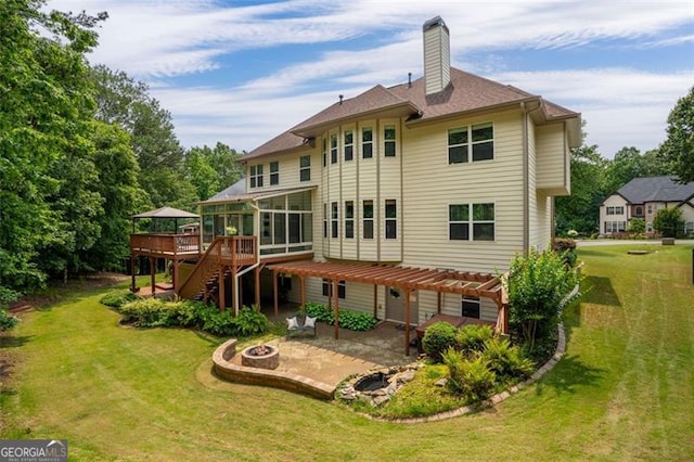 9065 Yellow Pine Ct, Gainesville, GA 30506 - back of house with a fire pit, a patio area, a deck, a sunroom, and a chimney