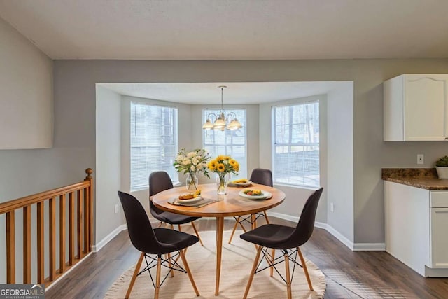 2105 Sandtree Ct SW, Atlanta, GA 30331 - dining room featuring plenty of natural light, wood finished floors, and a chandelier