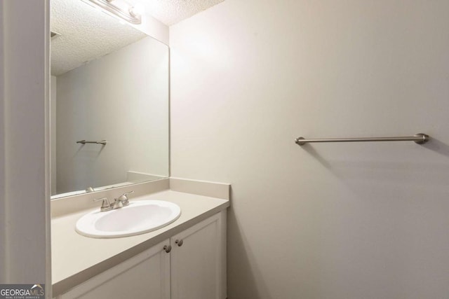 2105 Sandtree Ct SW, Atlanta, GA 30331 - bathroom featuring a textured ceiling and vanity