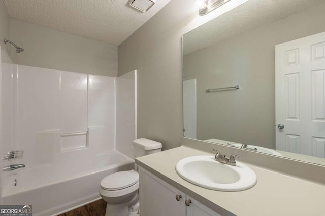 2105 Sandtree Ct SW, Atlanta, GA 30331 - full bathroom featuring a textured ceiling, vanity, wood finished floors, and bathing tub / shower combination