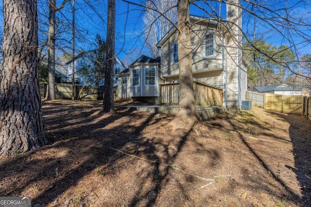 2105 Sandtree Ct SW, Atlanta, GA 30331 - back of house with a chimney and a fenced backyard