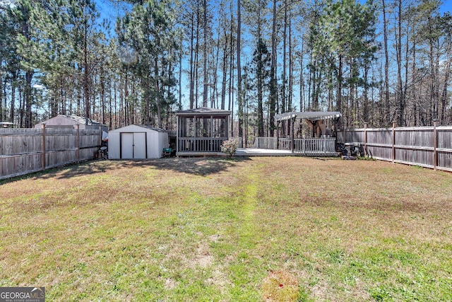 3929 Makeover Ct Unit 0, Atlanta, GA 30349 - view of yard featuring a wooden deck and a gazebo