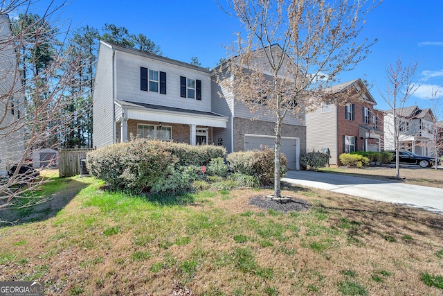 3929 Makeover Ct Unit 0, Atlanta, GA 30349 - view of front of property featuring concrete driveway, a garage, and brick siding