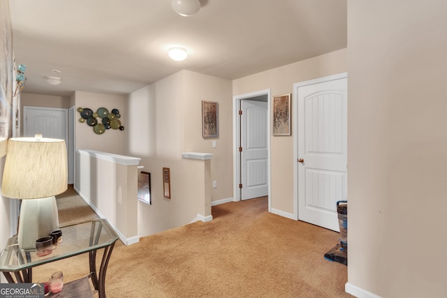 3929 Makeover Ct Unit 0, Atlanta, GA 30349 - hallway featuring carpet flooring, an upstairs landing, and baseboards