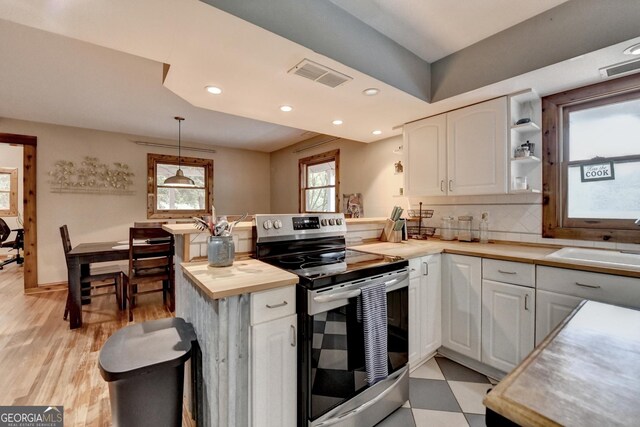 1365 Lower Creighton Rd, Cumming, GA 30028 - kitchen with electric range, wooden counters, white cabinetry, a peninsula, and recessed lighting