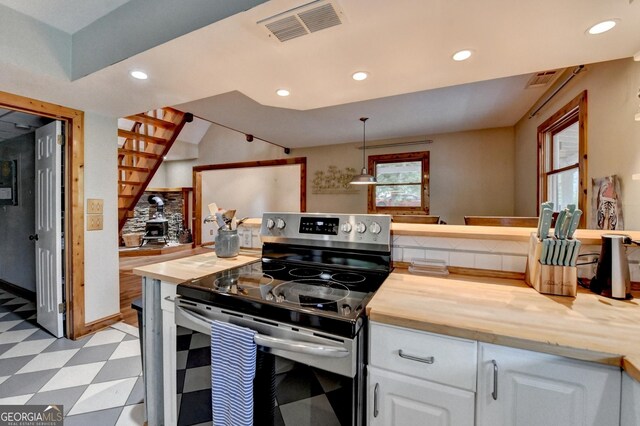 1365 Lower Creighton Rd, Cumming, GA 30028 - kitchen featuring electric range, light floors, butcher block countertops, recessed lighting, and white cabinetry