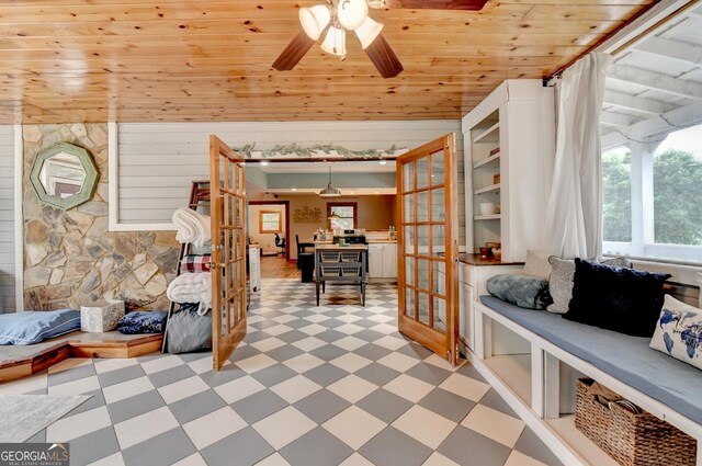 1365 Lower Creighton Rd, Cumming, GA 30028 - sitting room with light floors, wood ceiling, ceiling fan, french doors, and wood walls