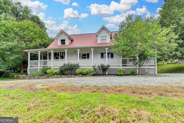 1365 Lower Creighton Rd, Cumming, GA 30028 - country-style home featuring covered porch and a metal roof