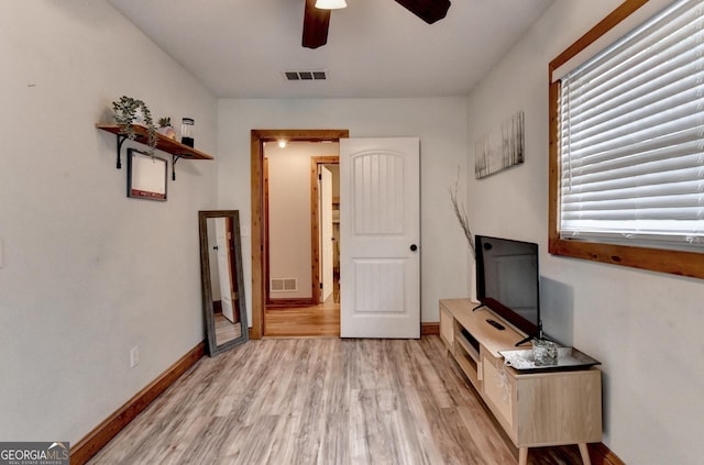 1365 Lower Creighton Rd, Cumming, GA 30028 - unfurnished living room with a ceiling fan and light wood-style flooring