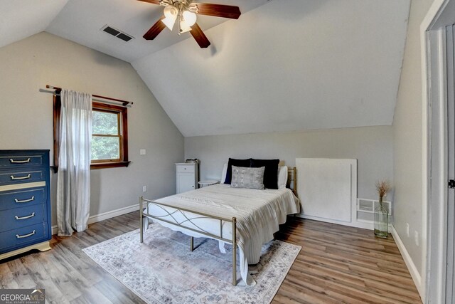 1365 Lower Creighton Rd, Cumming, GA 30028 - bedroom with light wood-style floors, lofted ceiling, and a ceiling fan