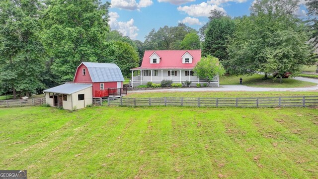 1365 Lower Creighton Rd, Cumming, GA 30028 - view of yard featuring a barn, an outdoor structure, and a porch