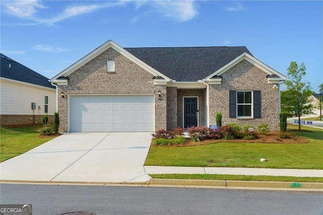 740 Pineberry Ct, Grayson, GA 30017 - view of front of property featuring driveway, an attached garage, a front yard, and brick siding
