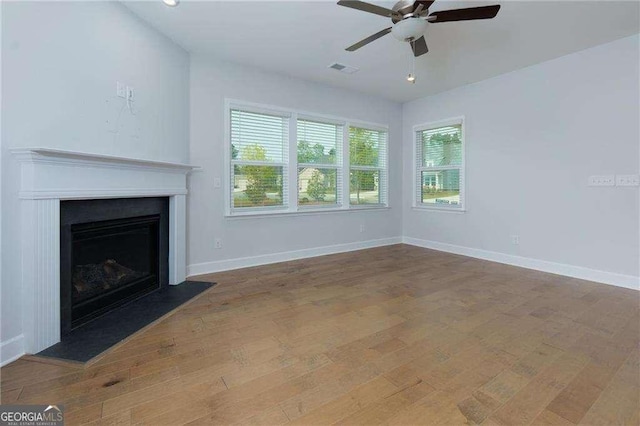 740 Pineberry Ct, Grayson, GA 30017 - unfurnished living room featuring ceiling fan, wood finished floors, and a fireplace