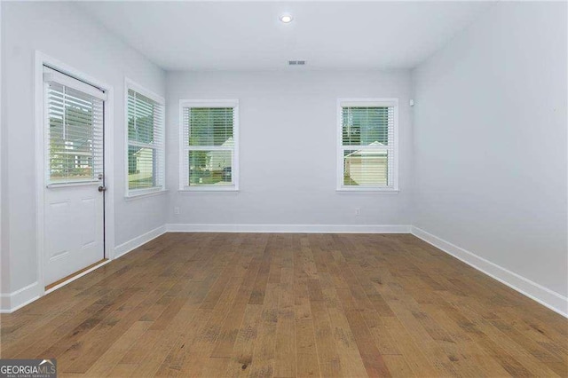 740 Pineberry Ct, Grayson, GA 30017 - empty room with hardwood / wood-style floors, plenty of natural light, and recessed lighting