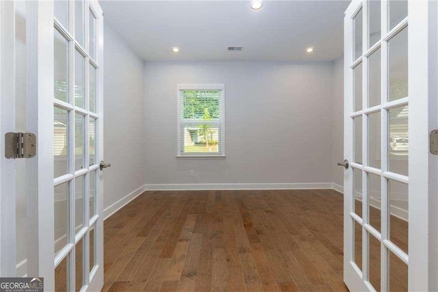 740 Pineberry Ct, Grayson, GA 30017 - empty room with french doors, wood finished floors, and recessed lighting