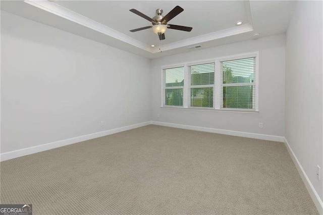 740 Pineberry Ct, Grayson, GA 30017 - spare room featuring a raised ceiling, ceiling fan, light carpet, recessed lighting, and crown molding