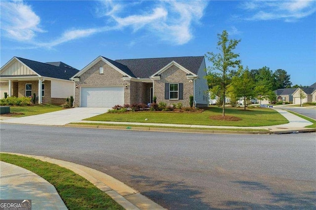 740 Pineberry Ct, Grayson, GA 30017 - view of front of home with brick siding, concrete driveway, a garage, and a front lawn