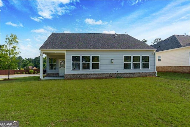 740 Pineberry Ct, Grayson, GA 30017 - rear view of house with a lawn