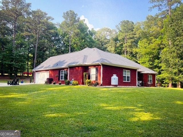 4954 Ga Highway 109, Molena, GA 30258 - single story home with a garage and a front yard