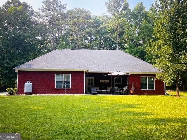 4954 Ga Highway 109, Molena, GA 30258 - view of front facade featuring a front yard and brick siding