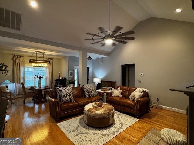 4954 Ga Highway 109, Molena, GA 30258 - living area featuring hardwood / wood-style floors, ceiling fan, baseboards, recessed lighting, and high vaulted ceiling