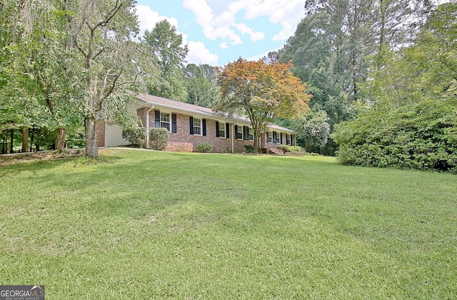 501 Bridlepath Ln, Peachtree City, GA 30269 - single story home featuring brick siding, a front lawn, and a garage