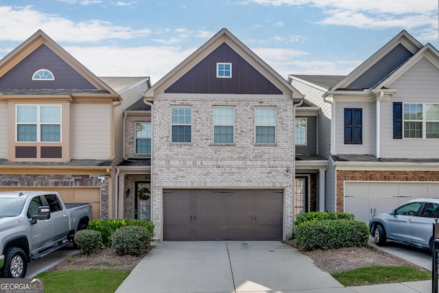 3393 Sardis Bend Dr, Buford, GA 30519 - view of property with a garage, driveway, and board and batten siding