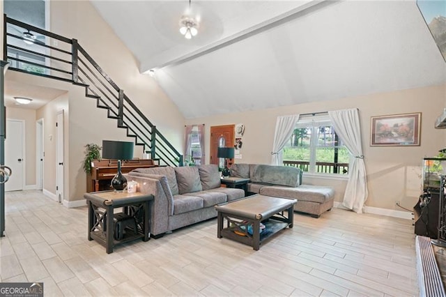 76 Beech Creek Cir, Winder, GA 30680 - living room with stairway, high vaulted ceiling, baseboards, wood finished floors, and beam ceiling