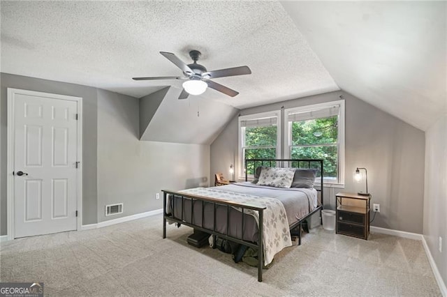 76 Beech Creek Cir, Winder, GA 30680 - carpeted bedroom featuring baseboards, vaulted ceiling, a textured ceiling, and ceiling fan