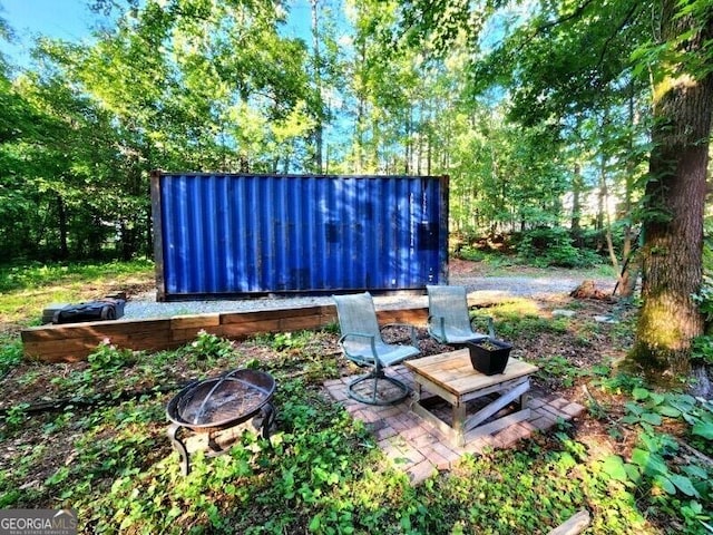 76 Beech Creek Cir, Winder, GA 30680 - view of yard with an outdoor fire pit
