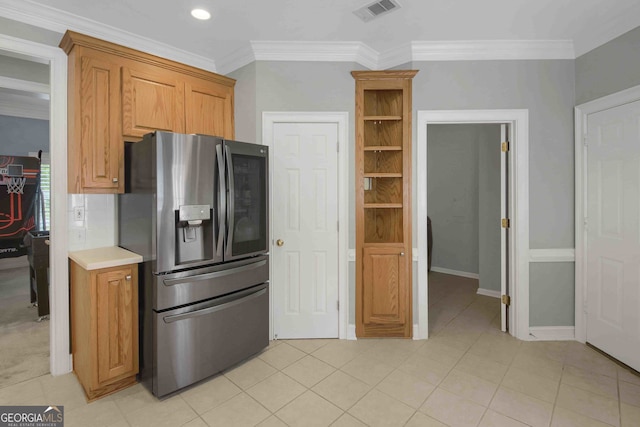 718 First Cotton Dr, Powder Springs, GA 30127 - kitchen with stainless steel refrigerator with ice dispenser, ornamental molding, light countertops, brown cabinetry, and light tile patterned flooring