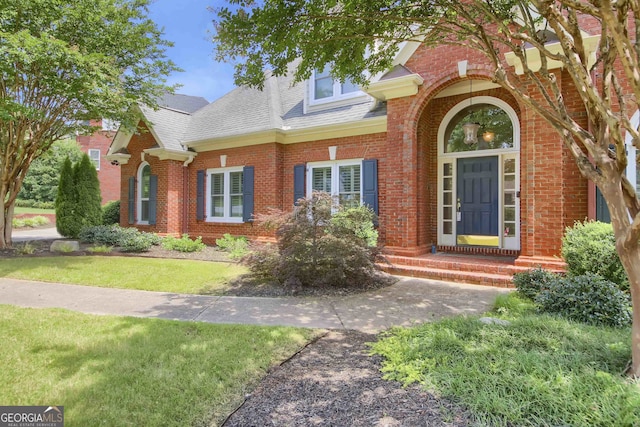 718 First Cotton Dr, Powder Springs, GA 30127 - view of front of property with brick siding, roof with shingles, and a front yard