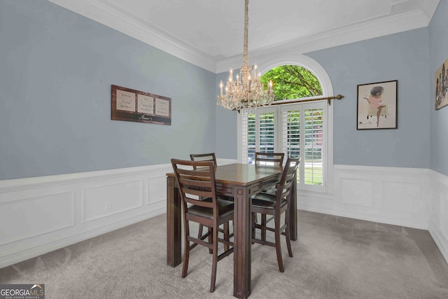 718 First Cotton Dr, Powder Springs, GA 30127 - carpeted dining space featuring a chandelier, crown molding, wainscoting, and a decorative wall