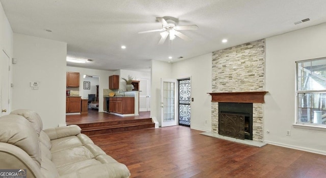 475 Cascade Rise Ct, South Fulton, GA 30331 - living room featuring a ceiling fan, dark wood-type flooring, a fireplace, and recessed lighting