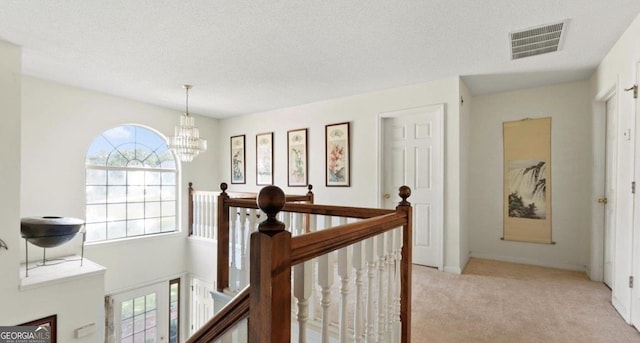 475 Cascade Rise Ct, South Fulton, GA 30331 - hall featuring an upstairs landing, carpet floors, a chandelier, and a textured ceiling