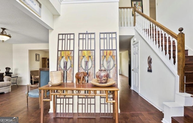 475 Cascade Rise Ct, South Fulton, GA 30331 - stairs with a high ceiling and wood finished floors