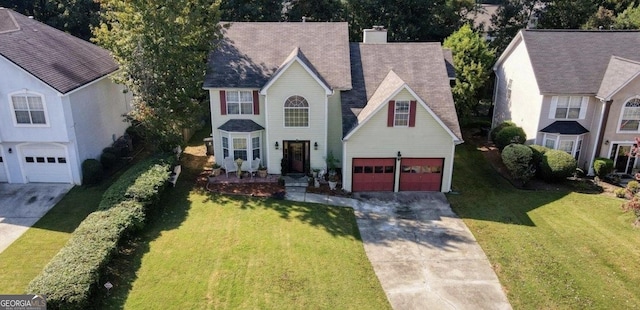 475 Cascade Rise Ct, South Fulton, GA 30331 - view of front of house with driveway, an attached garage, a chimney, and a front lawn