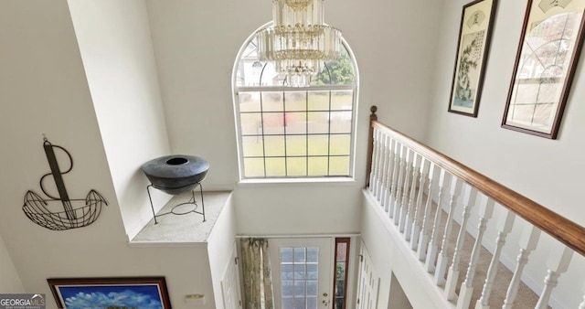 475 Cascade Rise Ct, South Fulton, GA 30331 - stairway with a towering ceiling, a chandelier, and plenty of natural light